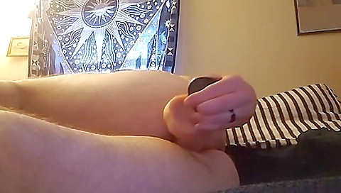 Solo amateur guy masturbates on the bed and plays with his penis!